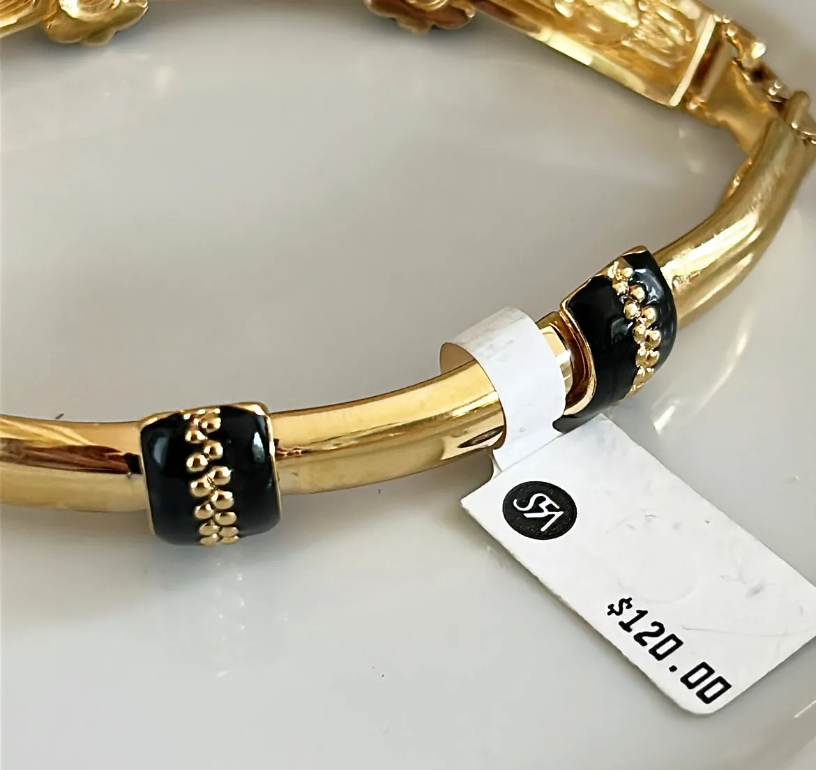 90s signed St.John designer gold link metal bracelet with black enamel accents.