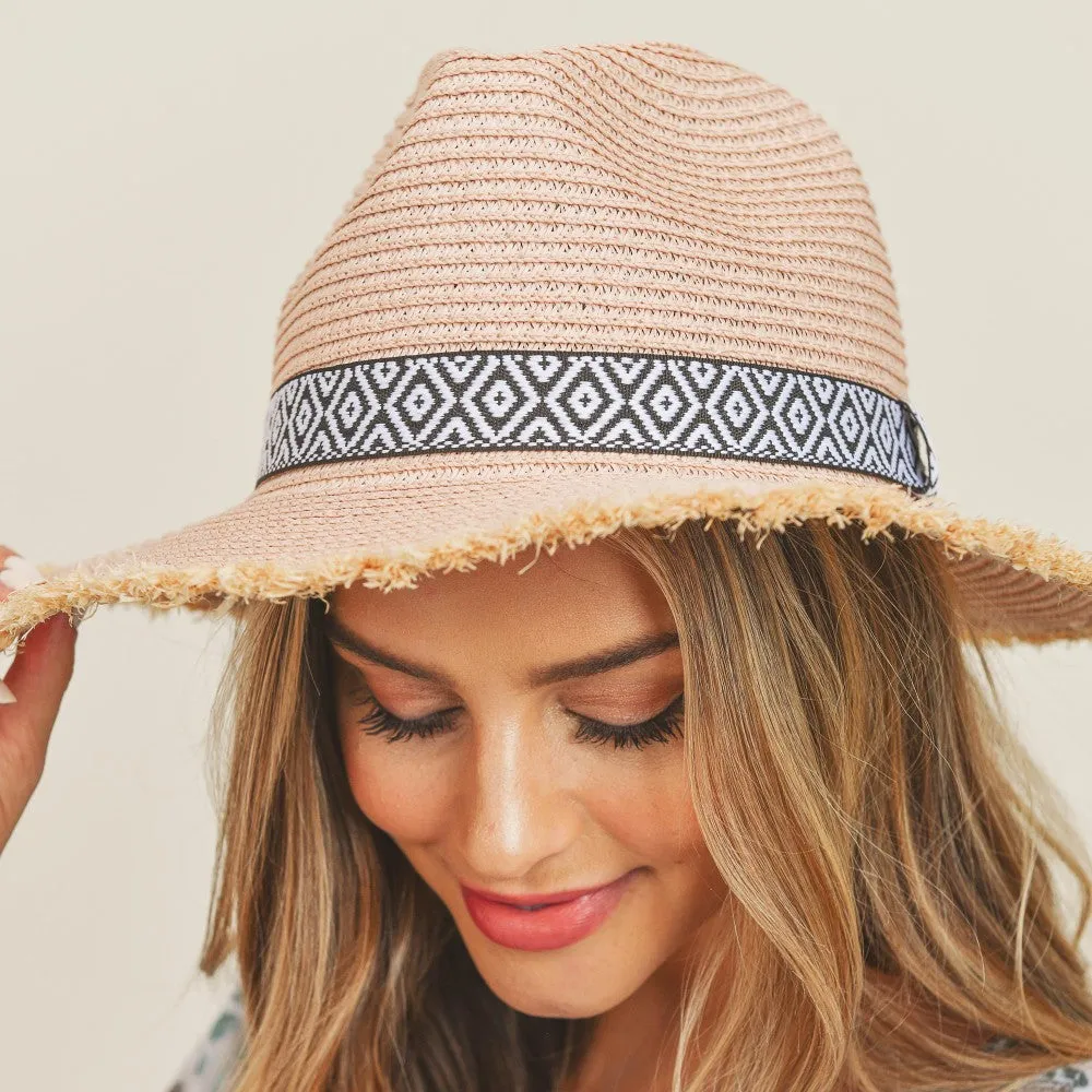 BLUSH STRAW PANAMA HAT WITH BLACK AND WHITE AZTEC BAND AND FRAYED EDGES