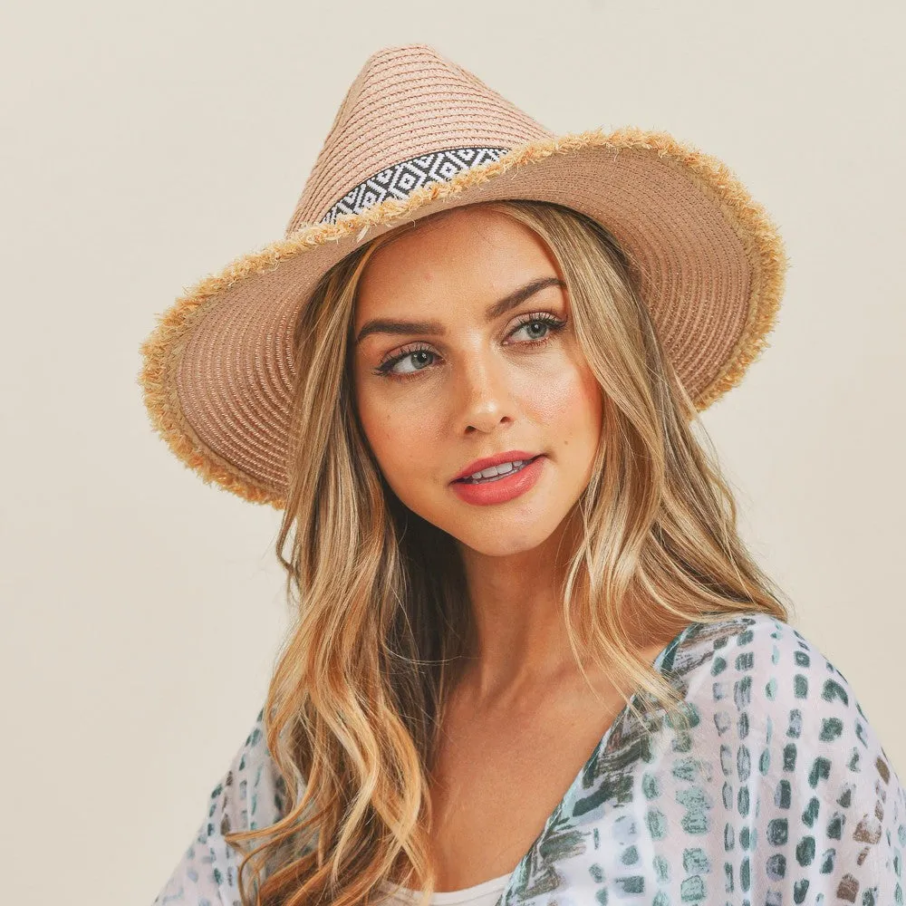 BLUSH STRAW PANAMA HAT WITH BLACK AND WHITE AZTEC BAND AND FRAYED EDGES